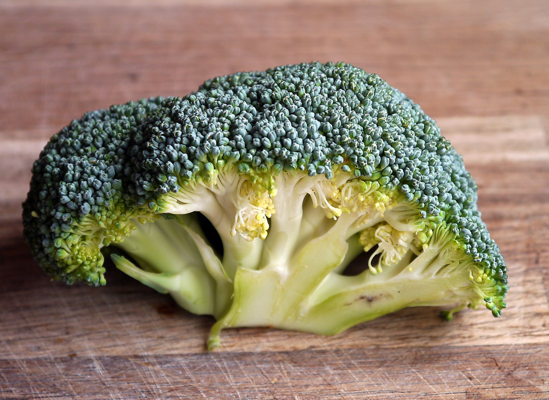 Vitamin C: Sources and 11 amazing health benefits 10 green broccoli vegetable on brown wooden table