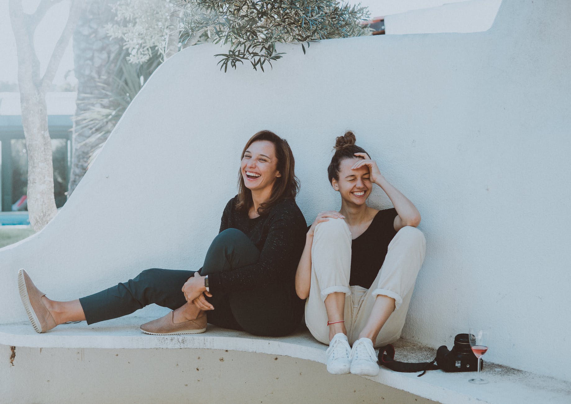 10 Daily habits that will change your life 8 two women sitting on white bench