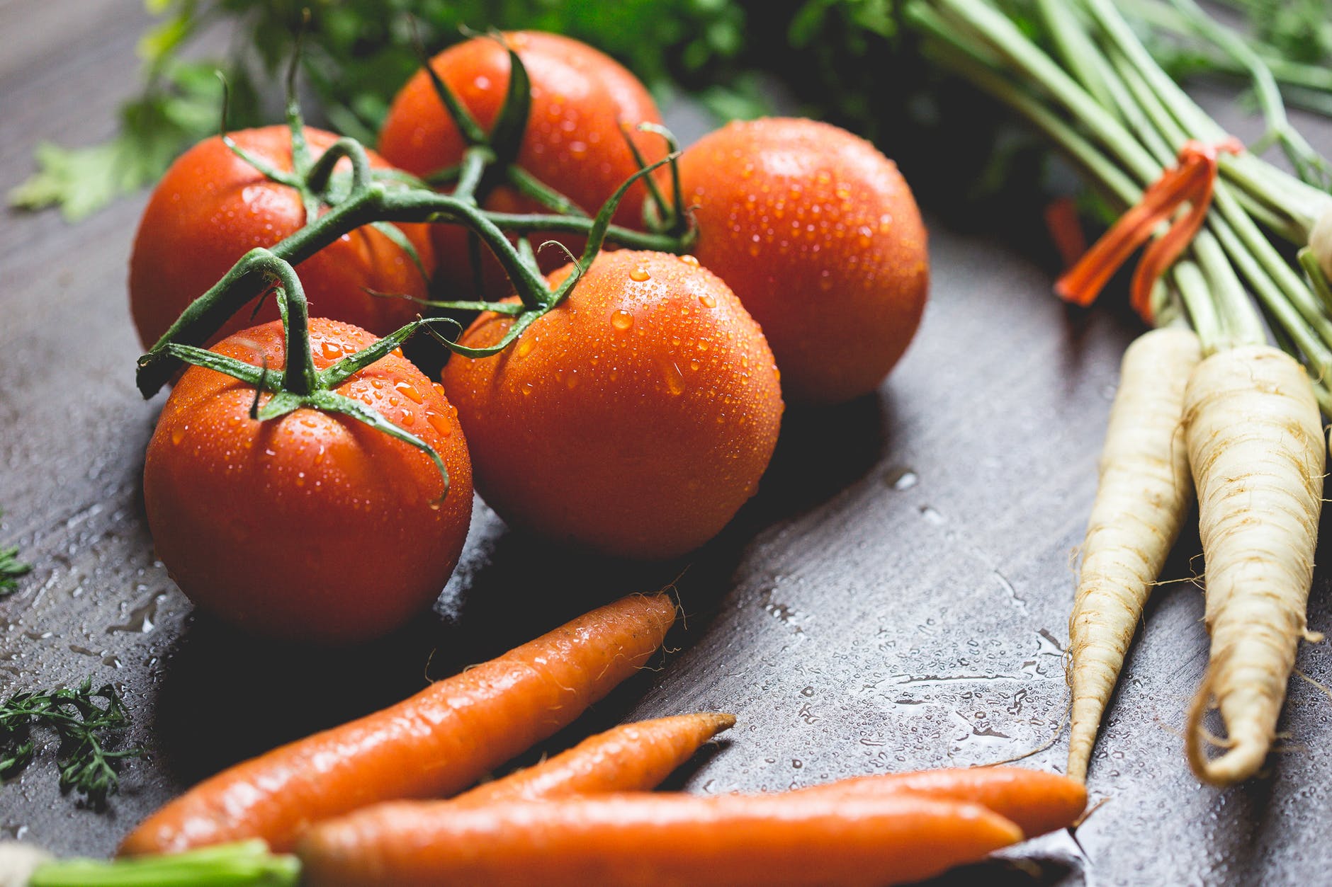 Vitamin C: Sources and 11 amazing health benefits 11 tomatoes carrots and radish on the top of the table